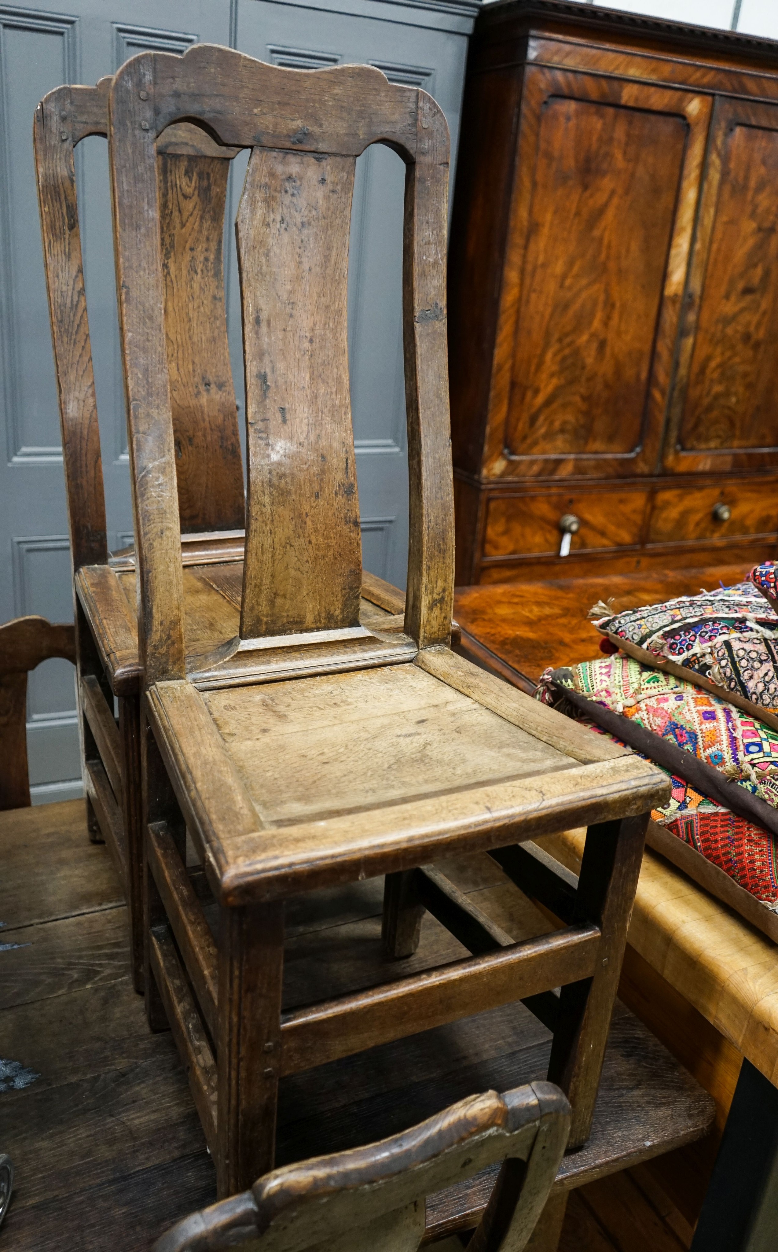 A set of six 18th century oak dining chairs with panelled backs and seats, width 42cm, depth 38cm, height 101cm